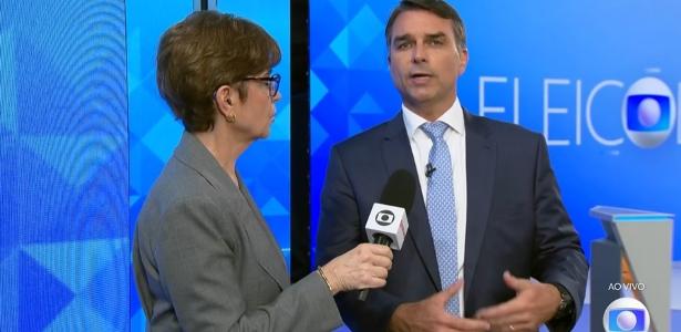Jornalista da Globo corrige Flávio sobre desmatamento: 'Recorde de baixa'